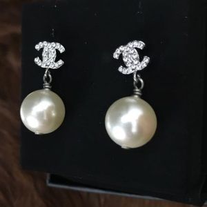 Brand new silver-tone Chanel CC earrings